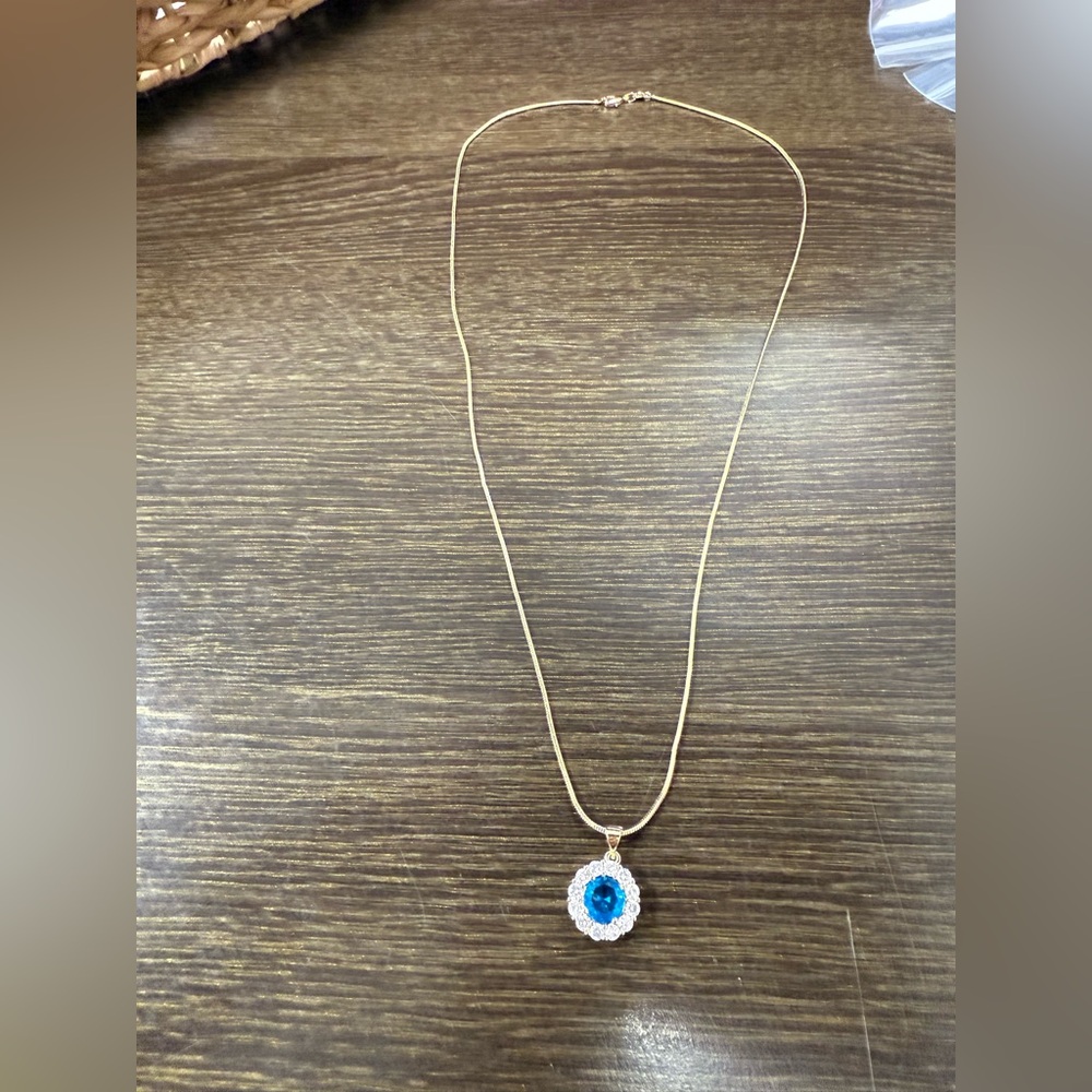 Gold Necklace with Blue Gemstone Pendant